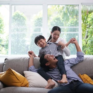 family in living room with lots of natural light 